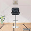 Modern black leather bar stool with chrome base and footrest, ideal for home or office