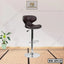 Modern adjustable bar stool with black cushioned seat and chrome base on indoor mat floor