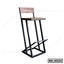 Modern bar stool with wooden seat and backrest, black metal frame, and footrest