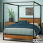 Modern canopy bed frame with wooden headboard, blue bedding, and bedside tables in a stylish bedroom