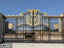 Decorative black and gold wrought iron boundary gate with ornate patterns for home entrance