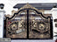 Decorative wrought iron boundary gate with gold floral patterns for home entrance