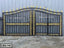 Decorative black and gold wrought iron gate with ornate patterns, ideal for modern exteriors.