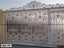 Decorative boundary gate with ornate white and gold casting design for home entrance