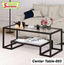 Modern glass top center table with black metal frame in a living room setting