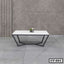 Modern center table with white rectangular top and black geometric metal legs, minimal decor