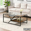 Modern glass and wood center table with metal frame in a living room setting