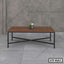 Modern center table with wooden top and black metal frame, minimalist decor on tile floor.