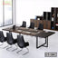Modern conference table with six black chairs, laptops, and office cabinets in meeting room