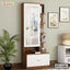 Modern wooden dressing table with mirror, storage shelves, and white drawer in a bedroom.