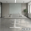 Modern height-adjustable conference table with laptops in a minimal office meeting room
