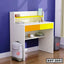 Modern kids study table with yellow drawers, open shelf, and books, set against a purple wall.