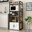 Modern kitchen storage rack with microwave, spice jars, and utensils, ideal for home organization.