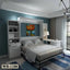 Modern bedroom with Murphy wall bed, built-in shelves, desk, and contemporary decor