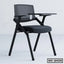 Modern black office chair with writing tablet and metal cup holder, ideal for workspace or training rooms.