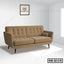 Modern beige office sofa with button tufting and bolster pillows in a bright room