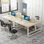 Modern office workstation desk set with computers, chairs, and storage shelves in a bright workspace