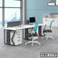 Modern office workstation with two desks, ergonomic chairs, storage drawers, and computer setup