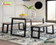Modern dining table set with two benches, metal frames, on patterned rug in bright room