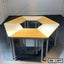 Set of modular hexagonal school benches with light wood surfaces and metal legs in a classroom