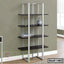Modern metal and wood bookshelf with decorative items in a contemporary living room