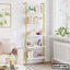 Modern white and gold bookshelf with books and decor in a bright living room setting
