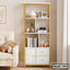 Modern white and gold bookshelf with drawers, decor items, and books in a cozy living room.