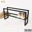 Modern black metal shoe rack with two beige sneakers, minimalist home furniture