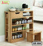 Wooden shoe rack with three shelves, storage drawer, and small side stool in modern living room.