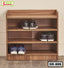 Wooden shoe rack with three shelves holding sneakers, modern home furniture for entryway