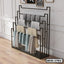 Modern standing closet organizer with multiple racks for hanging clothes and towels