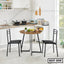 Modern steel and wood dining table set with two black chairs in a white kitchen