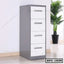 Steel file cabinet with four white drawers and silver handles in a modern office setting