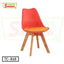 Modern red tulip chair with wooden legs and orange cushion, isolated on white background.