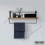 Modern wall shelf with wooden plank, metal frame, black towel, and toiletries on white wall.