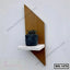 Modern wall shelf with geometric wooden back and a small potted plant on a white platform