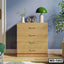 Modern wooden chest of drawers with silver handles in a stylish bedroom interior