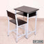 Modern student desk and chair set with metal frame and wooden surfaces, ideal for classrooms or study rooms.