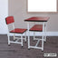 Red and white student desk and chair set on wooden floor, modern study furniture