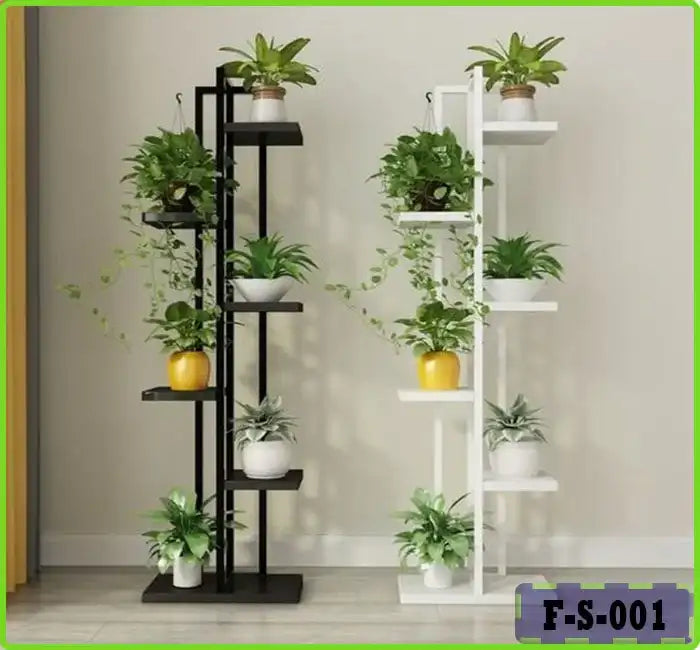 Modern indoor plant stands with small potted green plants in a minimalist room