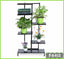 6-tier black metal flower rack with potted plants and books for indoor or outdoor use