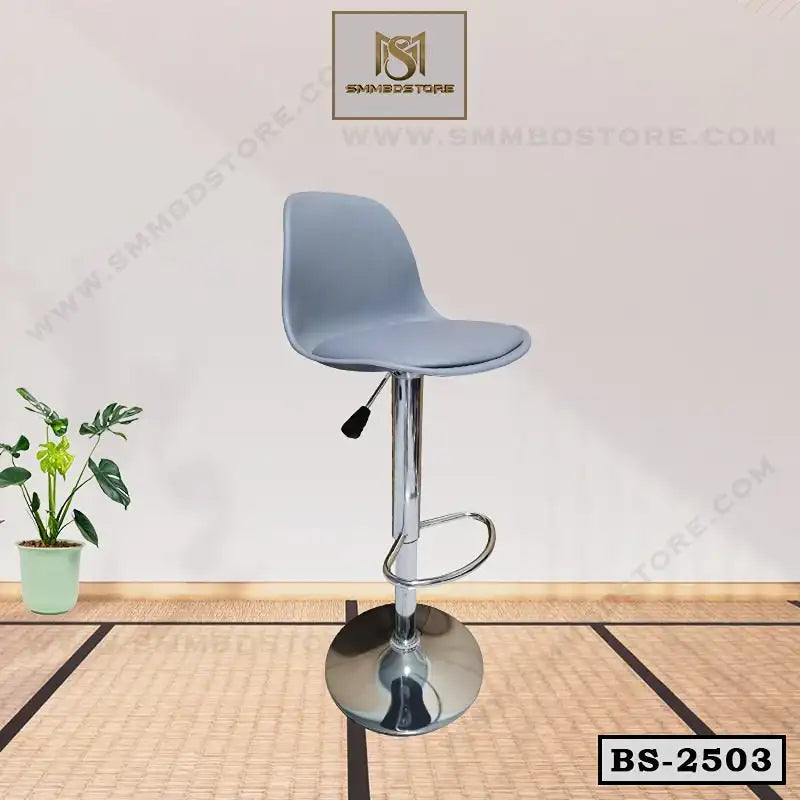 Modern adjustable bar stool with grey seat and chrome base on a bamboo mat floor