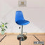 Modern adjustable blue bar stool with chrome base and footrest on a textured floor