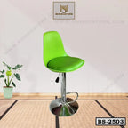 Modern green bar stool with chrome base, adjustable height, home or office furniture.