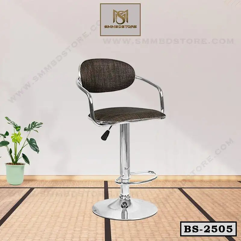 Modern adjustable bar stool with chrome base and dark fabric seat in a minimal indoor setting