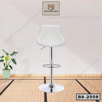 Modern white bar stool with chrome base and footrest on a tatami mat floor
