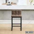 Modern brown upholstered bar stool with black metal legs in a contemporary home setting