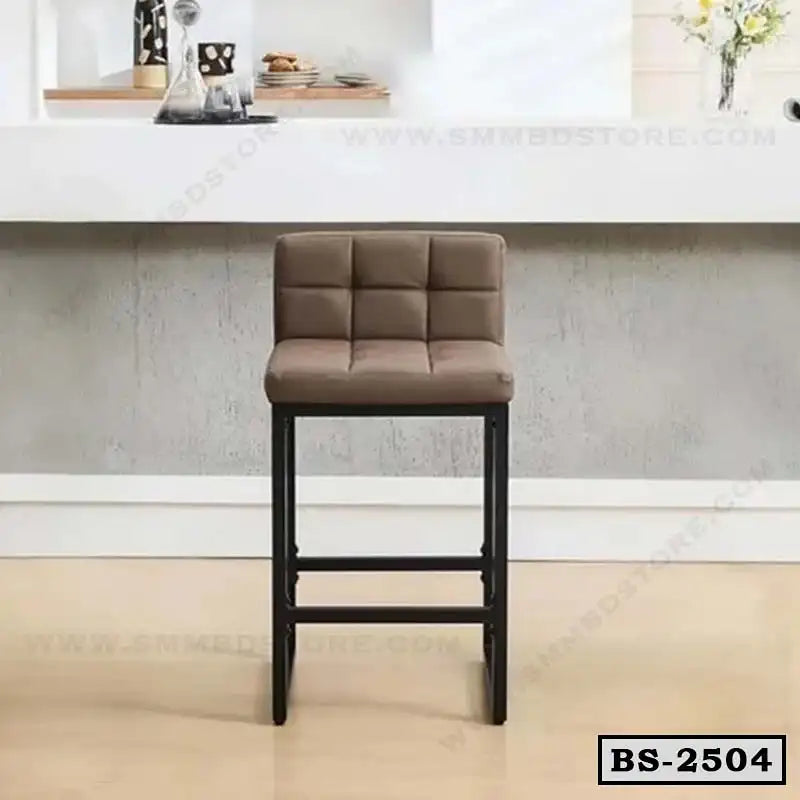 Modern brown upholstered bar stool with black metal legs in a contemporary home setting