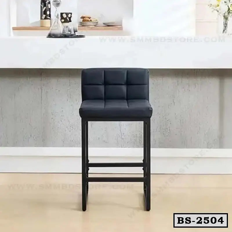 Modern black bar stool with cushioned seat and backrest in home kitchen setting