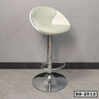 Modern adjustable bar stool with round chrome base and light cushioned seat against grey wall